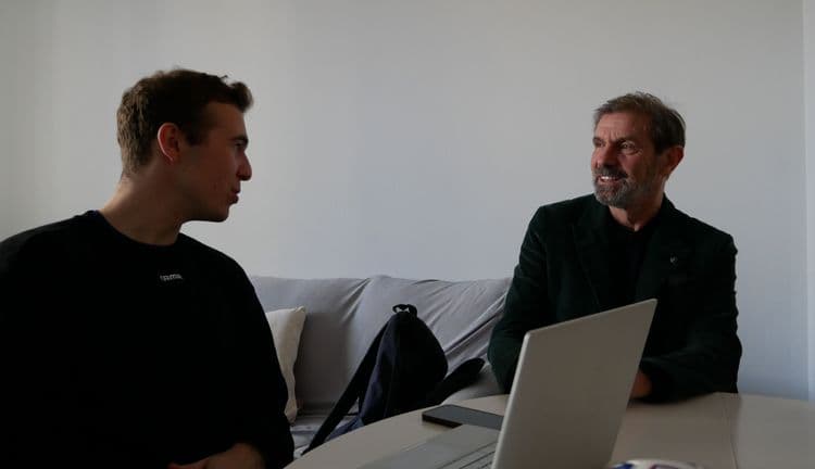 Two people talking in a living room