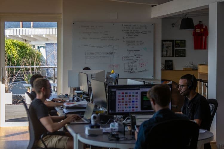 People sitting in front of computers in an office